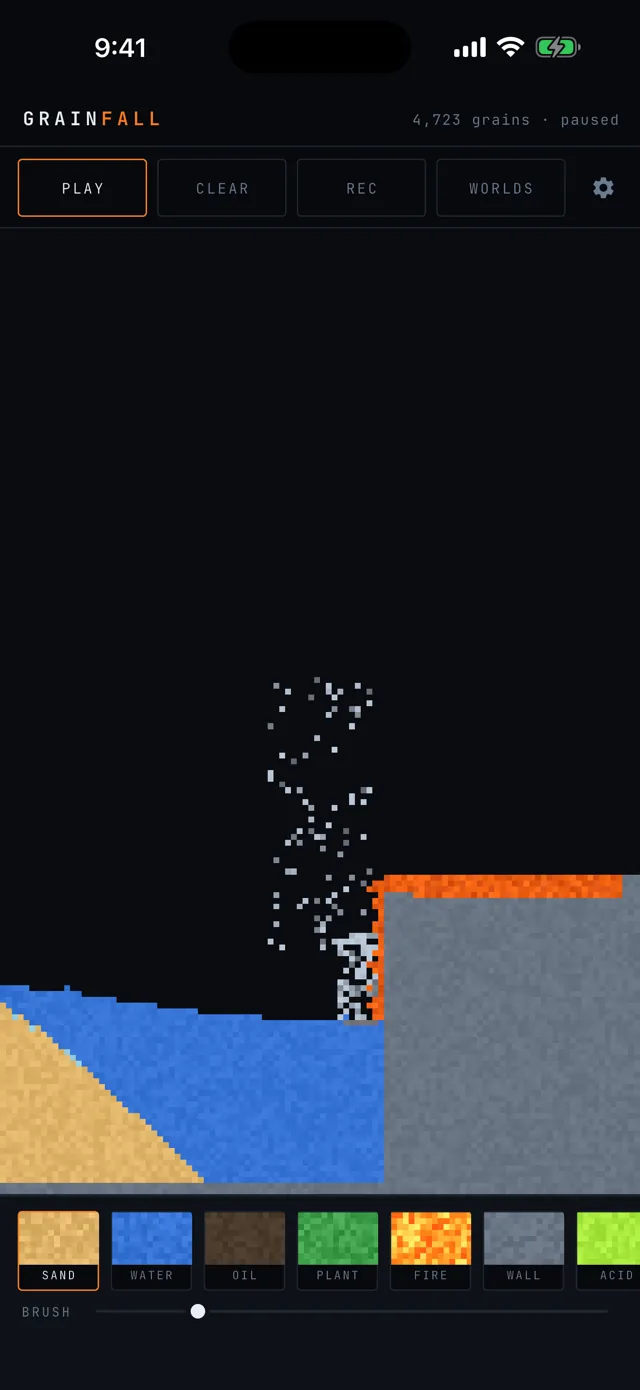 Lava pouring off a cliff into the sea, throwing up a column of steam