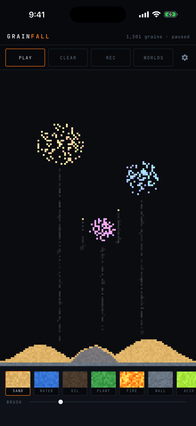 Three firework bursts in gold, blue, and violet over dunes at night